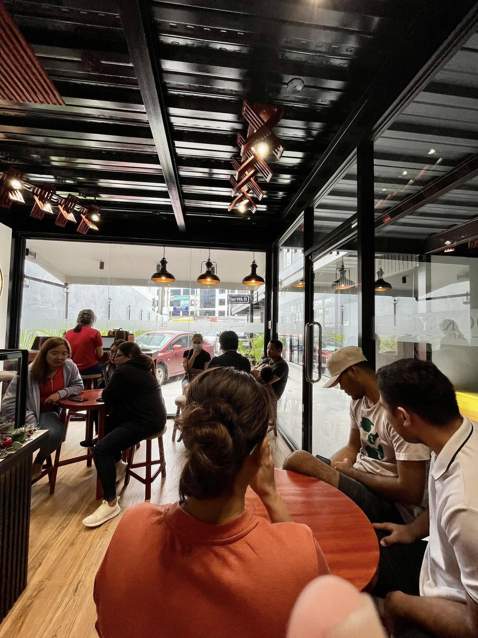 Guests seated at the tables under the covered area