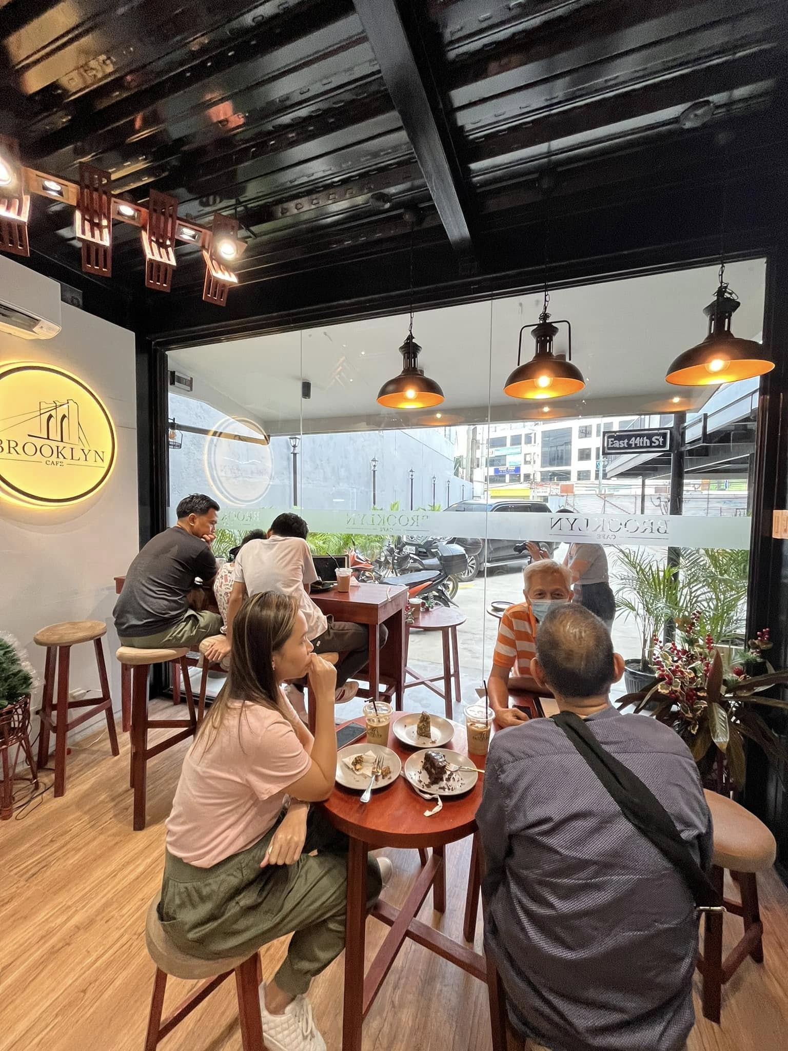 Guests at the window tables inside the cafe